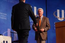 Former President Bill Clinton welcomes UT President William Powers Jr. to the stage.  Day one of the 2nd Annual Clinton Global Initiative University (CGIU) meeting was held at The University of Texas at Austin, Friday, February 13, 2009.

Filename: SRM_20090213_16292534.jpg
Aperture: f/4.0
Shutter Speed: 1/200
Body: Canon EOS-1D Mark II
Lens: Canon EF 80-200mm f/2.8 L
