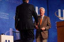 Former President Bill Clinton welcomes UT President William Powers Jr. to the stage.  Day one of the 2nd Annual Clinton Global Initiative University (CGIU) meeting was held at The University of Texas at Austin, Friday, February 13, 2009.

Filename: SRM_20090213_16292535.jpg
Aperture: f/4.0
Shutter Speed: 1/200
Body: Canon EOS-1D Mark II
Lens: Canon EF 80-200mm f/2.8 L