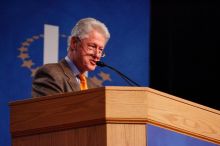Former President Bill Clinton hands out commitment certificates to CGIU attendees for their exceptional pledges to the CGI cause during the opening plenary session of the CGIU meeting.  Day one of the 2nd Annual Clinton Global Initiative University (CGIU) meeting was held at The University of Texas at Austin, Friday, February 13, 2009.