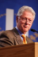 Former President Bill Clinton hands out commitment certificates to CGIU attendees for their exceptional pledges to the CGI cause during the opening plenary session of the CGIU meeting.  Day one of the 2nd Annual Clinton Global Initiative University (CGIU) meeting was held at The University of Texas at Austin, Friday, February 13, 2009.

Filename: SRM_20090213_16400293.jpg
Aperture: f/2.8
Shutter Speed: 1/250
Body: Canon EOS 20D
Lens: Canon EF 300mm f/2.8 L IS