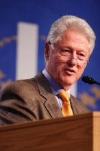 Former President Bill Clinton hands out commitment certificates to CGIU attendees for their exceptional pledges to the CGI cause during the opening plenary session of the CGIU meeting.  Day one of the 2nd Annual Clinton Global Initiative University (CGIU) meeting was held at The University of Texas at Austin, Friday, February 13, 2009.

Filename: SRM_20090213_16400294.jpg
Aperture: f/2.8
Shutter Speed: 1/250
Body: Canon EOS 20D
Lens: Canon EF 300mm f/2.8 L IS