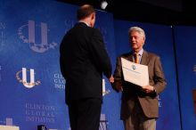 Former President Bill Clinton hands out commitment certificates to CGIU attendees for their exceptional pledges to the CGI cause during the opening plenary session of the CGIU meeting.  Day one of the 2nd Annual Clinton Global Initiative University (CGIU) meeting was held at The University of Texas at Austin, Friday, February 13, 2009.

Filename: SRM_20090213_16401335.jpg
Aperture: f/4.0
Shutter Speed: 1/200
Body: Canon EOS-1D Mark II
Lens: Canon EF 80-200mm f/2.8 L