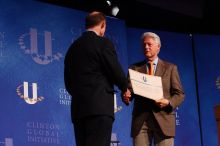 Former President Bill Clinton hands out commitment certificates to CGIU attendees for their exceptional pledges to the CGI cause during the opening plenary session of the CGIU meeting.  Day one of the 2nd Annual Clinton Global Initiative University (CGIU) meeting was held at The University of Texas at Austin, Friday, February 13, 2009.

Filename: SRM_20090213_16401336.jpg
Aperture: f/4.0
Shutter Speed: 1/200
Body: Canon EOS-1D Mark II
Lens: Canon EF 80-200mm f/2.8 L