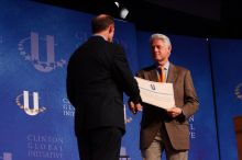 Former President Bill Clinton hands out commitment certificates to CGIU attendees for their exceptional pledges to the CGI cause during the opening plenary session of the CGIU meeting.  Day one of the 2nd Annual Clinton Global Initiative University (CGIU) meeting was held at The University of Texas at Austin, Friday, February 13, 2009.

Filename: SRM_20090213_16401337.jpg
Aperture: f/4.0
Shutter Speed: 1/200
Body: Canon EOS-1D Mark II
Lens: Canon EF 80-200mm f/2.8 L