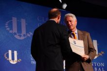 Former President Bill Clinton hands out commitment certificates to CGIU attendees for their exceptional pledges to the CGI cause during the opening plenary session of the CGIU meeting.  Day one of the 2nd Annual Clinton Global Initiative University (CGIU) meeting was held at The University of Texas at Austin, Friday, February 13, 2009.

Filename: SRM_20090213_16401438.jpg
Aperture: f/4.0
Shutter Speed: 1/200
Body: Canon EOS-1D Mark II
Lens: Canon EF 80-200mm f/2.8 L