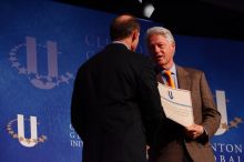 Former President Bill Clinton hands out commitment certificates to CGIU attendees for their exceptional pledges to the CGI cause during the opening plenary session of the CGIU meeting.  Day one of the 2nd Annual Clinton Global Initiative University (CGIU) meeting was held at The University of Texas at Austin, Friday, February 13, 2009.

Filename: SRM_20090213_16401439.jpg
Aperture: f/4.0
Shutter Speed: 1/200
Body: Canon EOS-1D Mark II
Lens: Canon EF 80-200mm f/2.8 L