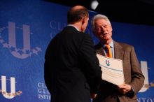 Former President Bill Clinton hands out commitment certificates to CGIU attendees for their exceptional pledges to the CGI cause during the opening plenary session of the CGIU meeting.  Day one of the 2nd Annual Clinton Global Initiative University (CGIU) meeting was held at The University of Texas at Austin, Friday, February 13, 2009.

Filename: SRM_20090213_16401440.jpg
Aperture: f/4.0
Shutter Speed: 1/160
Body: Canon EOS-1D Mark II
Lens: Canon EF 80-200mm f/2.8 L