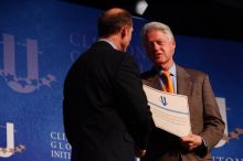 Former President Bill Clinton hands out commitment certificates to CGIU attendees for their exceptional pledges to the CGI cause during the opening plenary session of the CGIU meeting.  Day one of the 2nd Annual Clinton Global Initiative University (CGIU) meeting was held at The University of Texas at Austin, Friday, February 13, 2009.

Filename: SRM_20090213_16401441.jpg
Aperture: f/4.0
Shutter Speed: 1/200
Body: Canon EOS-1D Mark II
Lens: Canon EF 80-200mm f/2.8 L