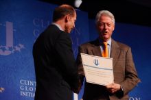 Former President Bill Clinton hands out commitment certificates to CGIU attendees for their exceptional pledges to the CGI cause during the opening plenary session of the CGIU meeting.  Day one of the 2nd Annual Clinton Global Initiative University (CGIU) meeting was held at The University of Texas at Austin, Friday, February 13, 2009.

Filename: SRM_20090213_16401542.jpg
Aperture: f/4.0
Shutter Speed: 1/200
Body: Canon EOS-1D Mark II
Lens: Canon EF 80-200mm f/2.8 L