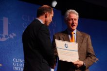 Former President Bill Clinton hands out commitment certificates to CGIU attendees for their exceptional pledges to the CGI cause during the opening plenary session of the CGIU meeting.  Day one of the 2nd Annual Clinton Global Initiative University (CGIU) meeting was held at The University of Texas at Austin, Friday, February 13, 2009.

Filename: SRM_20090213_16401543.jpg
Aperture: f/4.0
Shutter Speed: 1/200
Body: Canon EOS-1D Mark II
Lens: Canon EF 80-200mm f/2.8 L