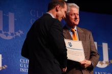 Former President Bill Clinton hands out commitment certificates to CGIU attendees for their exceptional pledges to the CGI cause during the opening plenary session of the CGIU meeting.  Day one of the 2nd Annual Clinton Global Initiative University (CGIU) meeting was held at The University of Texas at Austin, Friday, February 13, 2009.

Filename: SRM_20090213_16401644.jpg
Aperture: f/4.0
Shutter Speed: 1/200
Body: Canon EOS-1D Mark II
Lens: Canon EF 80-200mm f/2.8 L