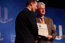 Former President Bill Clinton hands out commitment certificates to CGIU attendees for their exceptional pledges to the CGI cause during the opening plenary session of the CGIU meeting.  Day one of the 2nd Annual Clinton Global Initiative University (CGIU) meeting was held at The University of Texas at Austin, Friday, February 13, 2009.

Filename: SRM_20090213_16401645.jpg
Aperture: f/4.0
Shutter Speed: 1/200
Body: Canon EOS-1D Mark II
Lens: Canon EF 80-200mm f/2.8 L