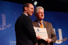 Former President Bill Clinton hands out commitment certificates to CGIU attendees for their exceptional pledges to the CGI cause during the opening plenary session of the CGIU meeting.  Day one of the 2nd Annual Clinton Global Initiative University (CGIU) meeting was held at The University of Texas at Austin, Friday, February 13, 2009.

Filename: SRM_20090213_16401946.jpg
Aperture: f/4.0
Shutter Speed: 1/160
Body: Canon EOS-1D Mark II
Lens: Canon EF 80-200mm f/2.8 L