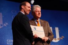 Former President Bill Clinton hands out commitment certificates to CGIU attendees for their exceptional pledges to the CGI cause during the opening plenary session of the CGIU meeting.  Day one of the 2nd Annual Clinton Global Initiative University (CGIU) meeting was held at The University of Texas at Austin, Friday, February 13, 2009.

Filename: SRM_20090213_16401947.jpg
Aperture: f/4.0
Shutter Speed: 1/160
Body: Canon EOS-1D Mark II
Lens: Canon EF 80-200mm f/2.8 L