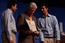 Former President Bill Clinton hands out commitment certificates to CGIU attendees for their exceptional pledges to the CGI cause during the opening plenary session of the CGIU meeting.  Day one of the 2nd Annual Clinton Global Initiative University (CGIU) meeting was held at The University of Texas at Austin, Friday, February 13, 2009.

Filename: SRM_20090213_16425383.jpg
Aperture: f/4.0
Shutter Speed: 1/250
Body: Canon EOS-1D Mark II
Lens: Canon EF 80-200mm f/2.8 L