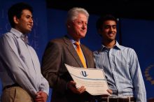 Former President Bill Clinton hands out commitment certificates to CGIU attendees for their exceptional pledges to the CGI cause during the opening plenary session of the CGIU meeting.  Day one of the 2nd Annual Clinton Global Initiative University (CGIU) meeting was held at The University of Texas at Austin, Friday, February 13, 2009.

Filename: SRM_20090213_16430090.jpg
Aperture: f/4.0
Shutter Speed: 1/250
Body: Canon EOS-1D Mark II
Lens: Canon EF 80-200mm f/2.8 L