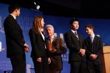 Former President Bill Clinton hands out commitment certificates to CGIU attendees for their exceptional pledges to the CGI cause during the opening plenary session of the CGIU meeting.  Day one of the 2nd Annual Clinton Global Initiative University (CGIU) meeting was held at The University of Texas at Austin, Friday, February 13, 2009.

Filename: SRM_20090213_16472527.jpg
Aperture: f/4.0
Shutter Speed: 1/125
Body: Canon EOS-1D Mark II
Lens: Canon EF 80-200mm f/2.8 L