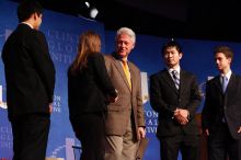 Former President Bill Clinton hands out commitment certificates to CGIU attendees for their exceptional pledges to the CGI cause during the opening plenary session of the CGIU meeting.  Day one of the 2nd Annual Clinton Global Initiative University (CGIU) meeting was held at The University of Texas at Austin, Friday, February 13, 2009.

Filename: SRM_20090213_16472830.jpg
Aperture: f/4.0
Shutter Speed: 1/125
Body: Canon EOS-1D Mark II
Lens: Canon EF 80-200mm f/2.8 L