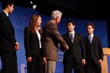 Former President Bill Clinton hands out commitment certificates to CGIU attendees for their exceptional pledges to the CGI cause during the opening plenary session of the CGIU meeting.  Day one of the 2nd Annual Clinton Global Initiative University (CGIU) meeting was held at The University of Texas at Austin, Friday, February 13, 2009.

Filename: SRM_20090213_16473033.jpg
Aperture: f/4.0
Shutter Speed: 1/125
Body: Canon EOS-1D Mark II
Lens: Canon EF 80-200mm f/2.8 L