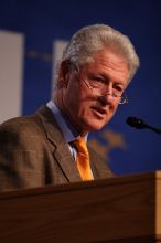 Former President Bill Clinton hands out commitment certificates to CGIU attendees for their exceptional pledges to the CGI cause during the opening plenary session of the CGIU meeting.  Day one of the 2nd Annual Clinton Global Initiative University (CGIU) meeting was held at The University of Texas at Austin, Friday, February 13, 2009.

Filename: SRM_20090213_16495121.jpg
Aperture: f/2.8
Shutter Speed: 1/320
Body: Canon EOS 20D
Lens: Canon EF 300mm f/2.8 L IS