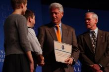 Former President Bill Clinton hands out commitment certificates to CGIU attendees for their exceptional pledges to the CGI cause during the opening plenary session of the CGIU meeting.  Day one of the 2nd Annual Clinton Global Initiative University (CGIU) meeting was held at The University of Texas at Austin, Friday, February 13, 2009.

Filename: SRM_20090213_16504874.jpg
Aperture: f/4.0
Shutter Speed: 1/250
Body: Canon EOS-1D Mark II
Lens: Canon EF 80-200mm f/2.8 L