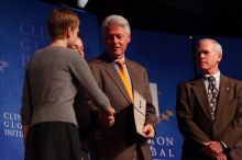Former President Bill Clinton hands out commitment certificates to CGIU attendees for their exceptional pledges to the CGI cause during the opening plenary session of the CGIU meeting.  Day one of the 2nd Annual Clinton Global Initiative University (CGIU) meeting was held at The University of Texas at Austin, Friday, February 13, 2009.

Filename: SRM_20090213_16504979.jpg
Aperture: f/4.0
Shutter Speed: 1/200
Body: Canon EOS-1D Mark II
Lens: Canon EF 80-200mm f/2.8 L