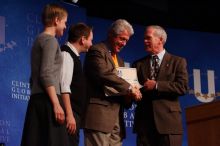 Former President Bill Clinton hands out commitment certificates to CGIU attendees for their exceptional pledges to the CGI cause during the opening plenary session of the CGIU meeting.  Day one of the 2nd Annual Clinton Global Initiative University (CGIU) meeting was held at The University of Texas at Austin, Friday, February 13, 2009.

Filename: SRM_20090213_16505485.jpg
Aperture: f/4.0
Shutter Speed: 1/200
Body: Canon EOS-1D Mark II
Lens: Canon EF 80-200mm f/2.8 L