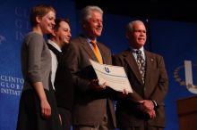 Former President Bill Clinton hands out commitment certificates to CGIU attendees for their exceptional pledges to the CGI cause during the opening plenary session of the CGIU meeting.  Day one of the 2nd Annual Clinton Global Initiative University (CGIU) meeting was held at The University of Texas at Austin, Friday, February 13, 2009.

Filename: SRM_20090213_16505888.jpg
Aperture: f/4.0
Shutter Speed: 1/250
Body: Canon EOS-1D Mark II
Lens: Canon EF 80-200mm f/2.8 L