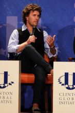 Blake Mycoskie, founder of TOMS shoes, donates one pair of shoes to a third world country for every pair of shoes they sell.  Day one of the 2nd Annual Clinton Global Initiative University (CGIU) meeting was held at The University of Texas at Austin, Friday, February 13, 2009.

Filename: SRM_20090213_17104175.jpg
Aperture: f/5.6
Shutter Speed: 1/250
Body: Canon EOS 20D
Lens: Canon EF 300mm f/2.8 L IS