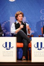 Blake Mycoskie, founder of TOMS shoes, donates one pair of shoes to a third world country for every pair of shoes they sell.  Day one of the 2nd Annual Clinton Global Initiative University (CGIU) meeting was held at The University of Texas at Austin, Friday, February 13, 2009.

Filename: SRM_20090213_17121467.jpg
Aperture: f/5.6
Shutter Speed: 1/100
Body: Canon EOS-1D Mark II
Lens: Canon EF 300mm f/2.8 L IS