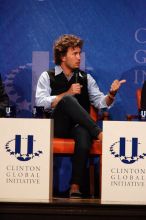 Blake Mycoskie, founder of TOMS shoes, donates one pair of shoes to a third world country for every pair of shoes they sell.  Day one of the 2nd Annual Clinton Global Initiative University (CGIU) meeting was held at The University of Texas at Austin, Friday, February 13, 2009.

Filename: SRM_20090213_17125373.jpg
Aperture: f/5.6
Shutter Speed: 1/250
Body: Canon EOS-1D Mark II
Lens: Canon EF 300mm f/2.8 L IS