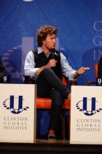 Blake Mycoskie, founder of TOMS shoes, donates one pair of shoes to a third world country for every pair of shoes they sell.  Day one of the 2nd Annual Clinton Global Initiative University (CGIU) meeting was held at The University of Texas at Austin, Friday, February 13, 2009.

Filename: SRM_20090213_17125374.jpg
Aperture: f/5.6
Shutter Speed: 1/250
Body: Canon EOS-1D Mark II
Lens: Canon EF 300mm f/2.8 L IS