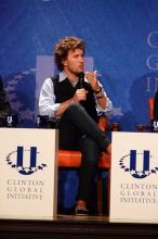 Blake Mycoskie, founder of TOMS shoes, donates one pair of shoes to a third world country for every pair of shoes they sell.  Day one of the 2nd Annual Clinton Global Initiative University (CGIU) meeting was held at The University of Texas at Austin, Friday, February 13, 2009.

Filename: SRM_20090213_17125776.jpg
Aperture: f/5.6
Shutter Speed: 1/250
Body: Canon EOS-1D Mark II
Lens: Canon EF 300mm f/2.8 L IS