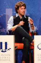 Blake Mycoskie, founder of TOMS shoes, donates one pair of shoes to a third world country for every pair of shoes they sell.  Day one of the 2nd Annual Clinton Global Initiative University (CGIU) meeting was held at The University of Texas at Austin, Friday, February 13, 2009.

Filename: SRM_20090213_17180731.jpg
Aperture: f/5.6
Shutter Speed: 1/200
Body: Canon EOS-1D Mark II
Lens: Canon EF 300mm f/2.8 L IS