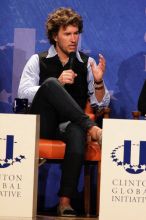 Blake Mycoskie, founder of TOMS shoes, donates one pair of shoes to a third world country for every pair of shoes they sell.  Day one of the 2nd Annual Clinton Global Initiative University (CGIU) meeting was held at The University of Texas at Austin, Friday, February 13, 2009.

Filename: SRM_20090213_17340794.jpg
Aperture: f/5.6
Shutter Speed: 1/200
Body: Canon EOS 20D
Lens: Canon EF 300mm f/2.8 L IS