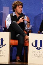 Blake Mycoskie, founder of TOMS shoes, donates one pair of shoes to a third world country for every pair of shoes they sell.  Day one of the 2nd Annual Clinton Global Initiative University (CGIU) meeting was held at The University of Texas at Austin, Friday, February 13, 2009.

Filename: SRM_20090213_17340996.jpg
Aperture: f/5.6
Shutter Speed: 1/200
Body: Canon EOS 20D
Lens: Canon EF 300mm f/2.8 L IS