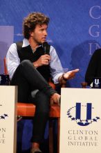 Blake Mycoskie, founder of TOMS shoes, donates one pair of shoes to a third world country for every pair of shoes they sell.  Day one of the 2nd Annual Clinton Global Initiative University (CGIU) meeting was held at The University of Texas at Austin, Friday, February 13, 2009.

Filename: SRM_20090213_17341501.jpg
Aperture: f/5.6
Shutter Speed: 1/200
Body: Canon EOS 20D
Lens: Canon EF 300mm f/2.8 L IS