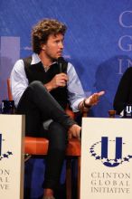 Blake Mycoskie, founder of TOMS shoes, donates one pair of shoes to a third world country for every pair of shoes they sell.  Day one of the 2nd Annual Clinton Global Initiative University (CGIU) meeting was held at The University of Texas at Austin, Friday, February 13, 2009.

Filename: SRM_20090213_17341602.jpg
Aperture: f/5.6
Shutter Speed: 1/200
Body: Canon EOS 20D
Lens: Canon EF 300mm f/2.8 L IS
