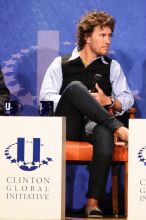 Blake Mycoskie, founder of TOMS shoes, donates one pair of shoes to a third world country for every pair of shoes they sell.  Day one of the 2nd Annual Clinton Global Initiative University (CGIU) meeting was held at The University of Texas at Austin, Friday, February 13, 2009.

Filename: SRM_20090213_17393543.jpg
Aperture: f/5.6
Shutter Speed: 1/125
Body: Canon EOS 20D
Lens: Canon EF 300mm f/2.8 L IS