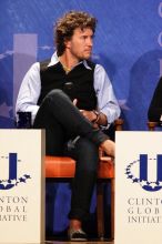 Blake Mycoskie, founder of TOMS shoes, donates one pair of shoes to a third world country for every pair of shoes they sell.  Day one of the 2nd Annual Clinton Global Initiative University (CGIU) meeting was held at The University of Texas at Austin, Friday, February 13, 2009.

Filename: SRM_20090213_17393745.jpg
Aperture: f/5.6
Shutter Speed: 1/160
Body: Canon EOS 20D
Lens: Canon EF 300mm f/2.8 L IS
