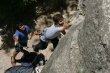 Andrew Dreher attempting the dyno while leading Lick the Window (5.10c) with Javier Morales belaying, shot from the top of Ack! (5.11b, but using the crack for the start instead) that I top roped up with my camera on my back.  It was another long day of rock climbing at Seismic Wall on Austin's Barton Creek Greenbelt, Sunday, April 5, 2009.

Filename: SRM_20090405_13212143.jpg
Aperture: f/11.0
Shutter Speed: 1/500
Body: Canon EOS-1D Mark II
Lens: Canon EF 80-200mm f/2.8 L