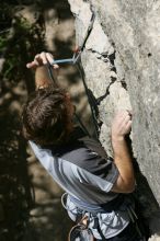 Andrew Dreher leading Lick the Window (5.10c), shot from the top of Ack! (5.11b, but using the crack for the start instead) that I top roped up with my camera on my back.  It was another long day of rock climbing at Seismic Wall on Austin's Barton Creek Greenbelt, Sunday, April 5, 2009.

Filename: SRM_20090405_13220469.jpg
Aperture: f/9.0
Shutter Speed: 1/500
Body: Canon EOS-1D Mark II
Lens: Canon EF 80-200mm f/2.8 L