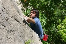 Javier Morales leading Nose Print on the Windshield (5.11c), shot from the top of Ack! (5.11b, but using the crack for the start instead) that I top roped up with my camera on my back.  It was another long day of rock climbing at Seismic Wall on Austin's Barton Creek Greenbelt, Sunday, April 5, 2009.

Filename: SRM_20090405_13335779.jpg
Aperture: f/9.0
Shutter Speed: 1/500
Body: Canon EOS-1D Mark II
Lens: Canon EF 80-200mm f/2.8 L