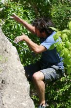 Javier Morales leading Nose Print on the Windshield (5.11c), shot from the top of Ack! (5.11b, but using the crack for the start instead) that I top roped up with my camera on my back.  It was another long day of rock climbing at Seismic Wall on Austin's Barton Creek Greenbelt, Sunday, April 5, 2009.

Filename: SRM_20090405_13342900.jpg
Aperture: f/8.0
Shutter Speed: 1/500
Body: Canon EOS-1D Mark II
Lens: Canon EF 80-200mm f/2.8 L