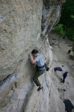 Hannah Norton top rope climbing Diving for Rocks (5.10d), photographed from  the third bolt of Magster (5.10a).  It was another long day of rock climbing at Seismic Wall on Austin's Barton Creek Greenbelt, Saturday, April 11, 2009.

Filename: SRM_20090411_16100540.JPG
Aperture: f/5.0
Shutter Speed: 1/250
Body: Canon EOS-1D Mark II
Lens: Canon EF 16-35mm f/2.8 L