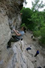 Hannah Norton top rope climbing Diving for Rocks (5.10d), photographed from  the third bolt of Magster (5.10a).  It was another long day of rock climbing at Seismic Wall on Austin's Barton Creek Greenbelt, Saturday, April 11, 2009.

Filename: SRM_20090411_16102842.JPG
Aperture: f/5.0
Shutter Speed: 1/250
Body: Canon EOS-1D Mark II
Lens: Canon EF 16-35mm f/2.8 L