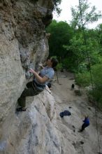 Hannah Norton top rope climbing Diving for Rocks (5.10d), photographed from  the third bolt of Magster (5.10a).  It was another long day of rock climbing at Seismic Wall on Austin's Barton Creek Greenbelt, Saturday, April 11, 2009.

Filename: SRM_20090411_16102843.JPG
Aperture: f/5.0
Shutter Speed: 1/250
Body: Canon EOS-1D Mark II
Lens: Canon EF 16-35mm f/2.8 L