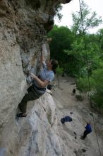 Hannah Norton top rope climbing Diving for Rocks (5.10d), photographed from  the third bolt of Magster (5.10a).  It was another long day of rock climbing at Seismic Wall on Austin's Barton Creek Greenbelt, Saturday, April 11, 2009.

Filename: SRM_20090411_16102844.JPG
Aperture: f/5.0
Shutter Speed: 1/250
Body: Canon EOS-1D Mark II
Lens: Canon EF 16-35mm f/2.8 L