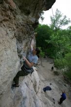 Hannah Norton top rope climbing Diving for Rocks (5.10d), photographed from  the third bolt of Magster (5.10a).  It was another long day of rock climbing at Seismic Wall on Austin's Barton Creek Greenbelt, Saturday, April 11, 2009.

Filename: SRM_20090411_16102847.JPG
Aperture: f/5.0
Shutter Speed: 1/250
Body: Canon EOS-1D Mark II
Lens: Canon EF 16-35mm f/2.8 L