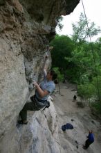 Hannah Norton top rope climbing Diving for Rocks (5.10d), photographed from  the third bolt of Magster (5.10a).  It was another long day of rock climbing at Seismic Wall on Austin's Barton Creek Greenbelt, Saturday, April 11, 2009.

Filename: SRM_20090411_16102848.JPG
Aperture: f/5.0
Shutter Speed: 1/250
Body: Canon EOS-1D Mark II
Lens: Canon EF 16-35mm f/2.8 L